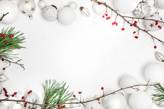 Christmas white wood background with bauble and red berries