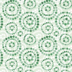 Seamless pattern with colorful abstract circles on green background