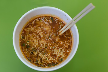 Instant noodles with chopsticks. cup noodles. cup ramen