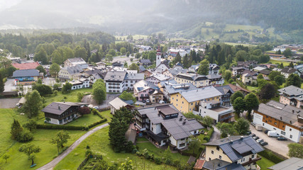 Fototapeta premium Aerial view of a village in the alpine mountains, Lofer, Austria