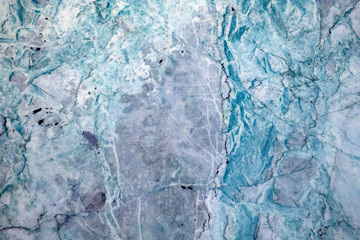 Multicolored layered marble texture with different veins and scratches, may be used as background