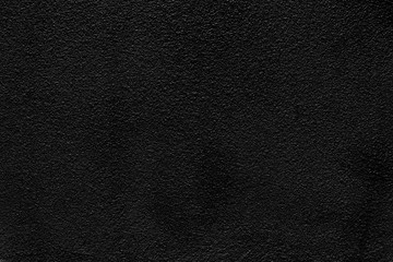 Abstact background from black concrete texture wall. Dark tone backdrop.