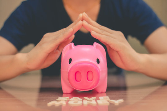 Save money in pig pink for future use, Concept saving money for the future.