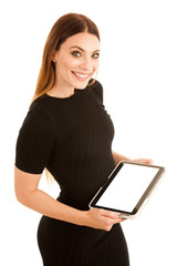 Young happy business woman shows a tablet wth blank display isolated over white background