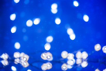 Christmas background pattern with lights garland.