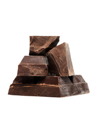 Blocks and pieces dark chocolate on a white background