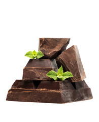 Blocks and pieces dark chocolate on a white background