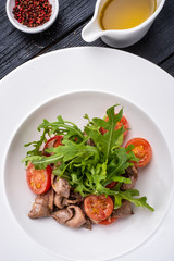 Italian salad with roast beef, arugula, cherry tomatoes and balsamic dressing.