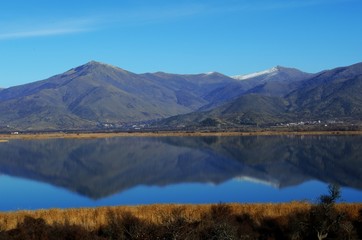 Reflections in Prespes lakes, Agios Achilios island, northern Greece
