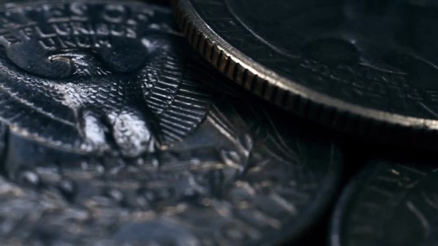 pile of quarter United States dollar coins. Close Up. finance and business concept