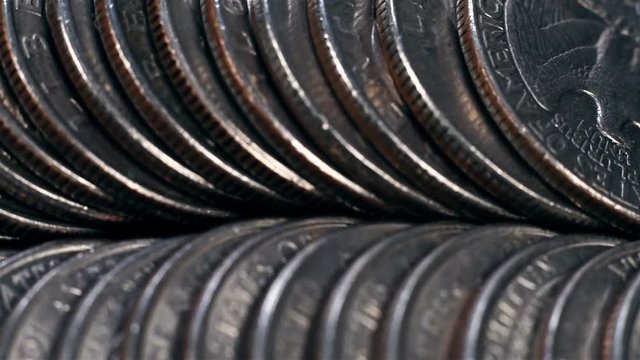 pile of quarter United States dollar coins. Close Up