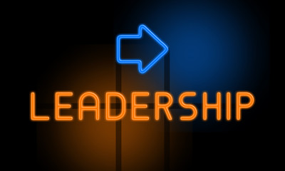 Leadership - orange glowing text with an arrow on dark background