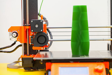 Modern three dimensional printer during work.