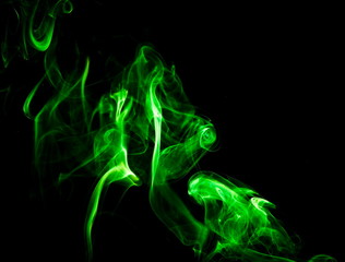 Green smoke on black background