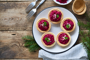 Tartlets with beetroot and cheese on a plate