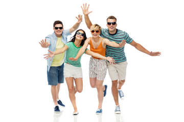 friendship, summer and people concept - group of happy smiling friends in sunglasses having fun over white background
