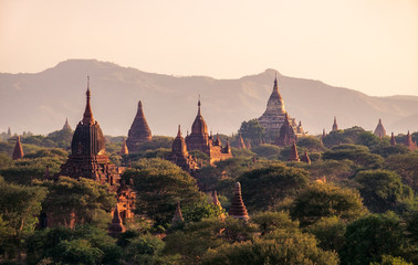 Landscape view of ancient temples at colorful golden sunset, Bagan, Myanmar