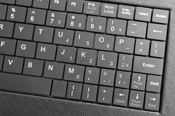 Closeup of black keyboard of tablet. Selective focus.
