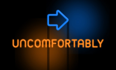 Uncomfortably - orange glowing text with an arrow on dark background