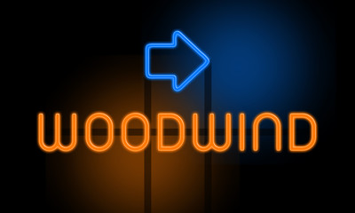 Woodwind - orange glowing text with an arrow on dark background