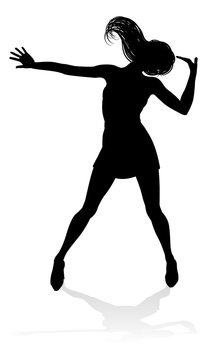 A woman dancer dancing in silhouette