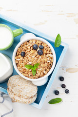Healthy breakfast set with muesli, berries and milk