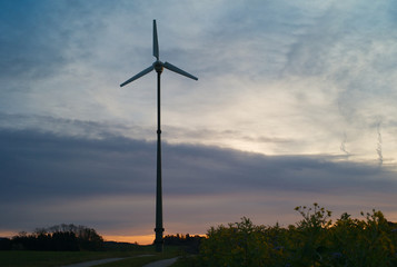 Fototapeta na wymiar Single Electric Wind Power Station at Dawn