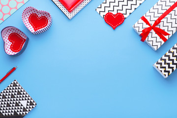 Fototapeta premium Person holding a present for Saint Valentine's day in his hands. Beautiful colorful background to st. Valentine day. Greeting card with red hearts. Wedding's invitation. Love expression. 