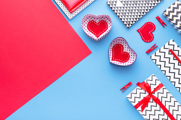 Person holding a present for Saint Valentine's day in his hands. Beautiful colorful background to st. Valentine day. Greeting card with red hearts. Wedding's invitation. Love expression. 