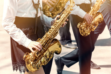 Fototapeta premium A group of teenagers playing in a school orchestra