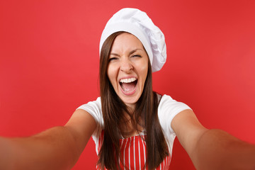 Housewife female chef cook or baker in striped apron, white t-shirt, toque chefs hat isolated on...