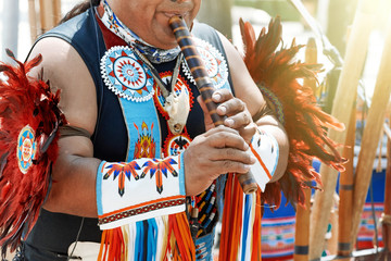 Man plying flute © SKfoto