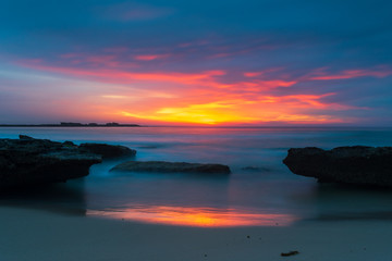 Sunrise at Pretty Beach on the South Coast of New South Wales. Bright colours, sand and surf in Australia.