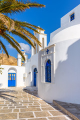 Serifos island with lovely whitewashed church and blue doors. Cyclades, Greece © vivoo