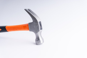 Hammer closeup on white background with selective focus and crop fragment