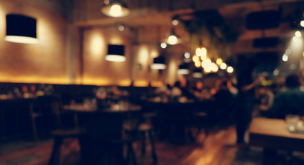 Coffee shop blur background with bokeh light with vintage filter