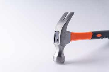 Hammer closeup on white background with selective focus and crop fragment