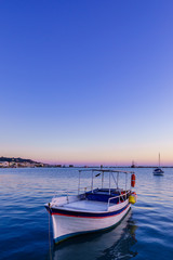 Naklejka premium wooden fishing boat moored in port of Zante town.