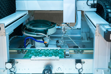 soldering iron tips of robotic system for automatic point soldering for printed and assembly electric circuit board ( PCB ) at factory