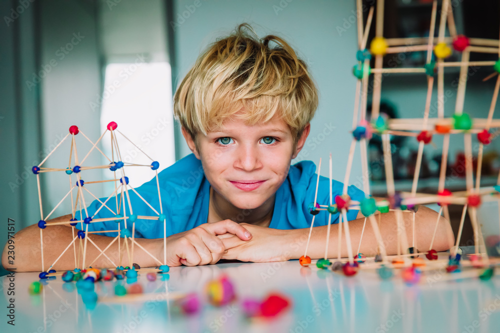 Wall mural child making geometric shapes, engineering and stem