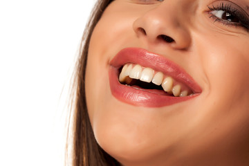 Smiling woman with natural and healthy teeth