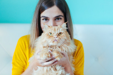 portrait of young woman and healthy cat