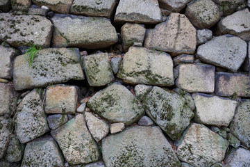 Rough cut stones in ancient Japanese castle wall