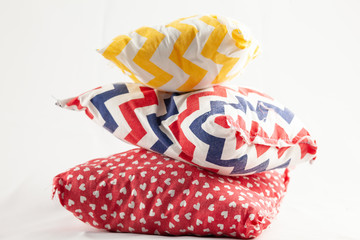 Fototapeta premium three multi-colored pillows