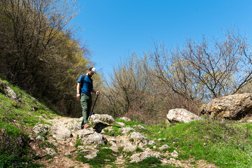 Fototapeta premium Man hiking on a sunny day
