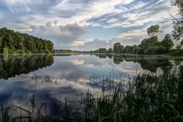 clouds and lake in forest hdr