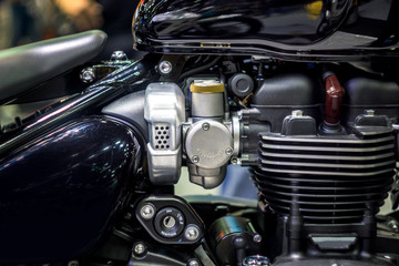 Selective Focus of  Carburetor of Motorcycle on background,  Technology to mix fuel with air to ignition engine to work.
