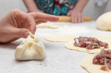 Cooking dough with meat on the table