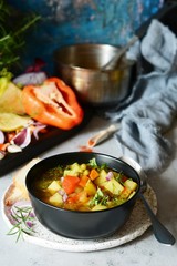 A bowl of delicious Italian vegetable soup Minestrone. Selective focus.