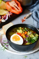 A bowl of delicious Italian vegetable soup Minestrone. Selective focus.